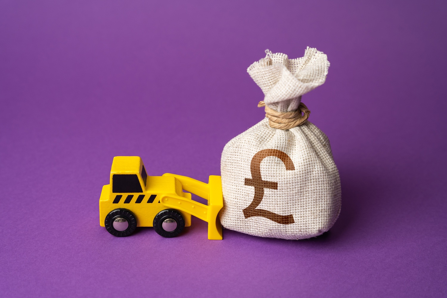 Bulldozer pushing money