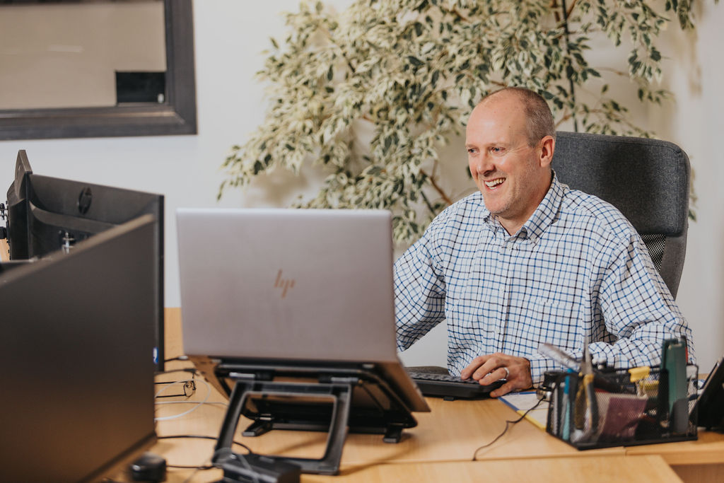 Nick at his desk